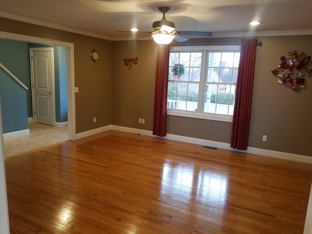 18 Channing Road East Longmeadow, MA 01108 - Photo 6 of 40 an empty room with wooden floor chandelier and windows