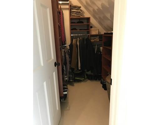 41 Trueman Street Needham, MA 02494 - Photo 18 of 24 a view of walk in closet with clothes and shoes