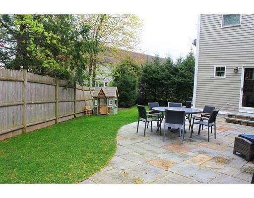 41 Trueman Street Needham, MA 02494 - Photo 22 of 24 a view of a backyard with table and chairs