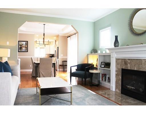 41 Trueman Street Needham, MA 02494 - Photo 3 of 24 a living room with furniture a fireplace and a table