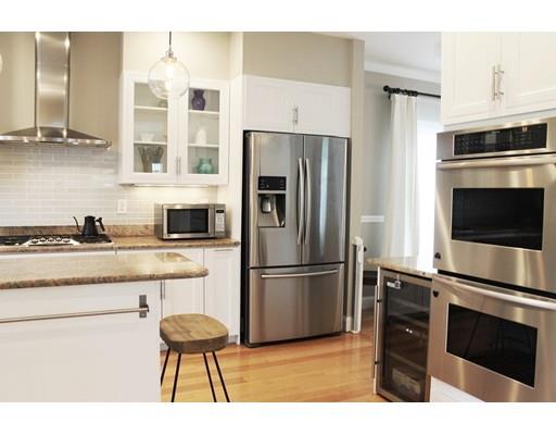 41 Trueman Street Needham, MA 02494 - Photo 6 of 24 a kitchen with stainless steel appliances a stove a refrigerator and a sink