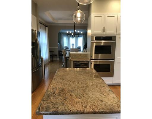 41 Trueman Street Needham, MA 02494 - Photo 7 of 24 a living room with stainless steel appliances kitchen island granite countertop a refrigerator stove and sink