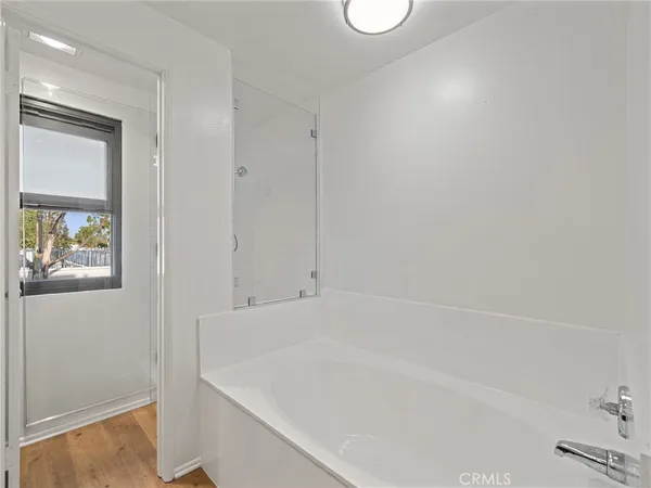 a white bath tub sitting next to a window