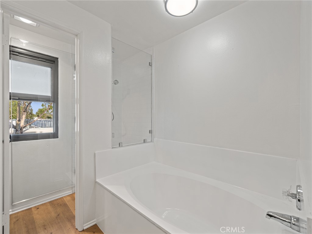 8180 Manitoba Street, Unit 302 Playa del Rey, CA 90293 - Photo 14 of 31 a white bath tub sitting next to a window