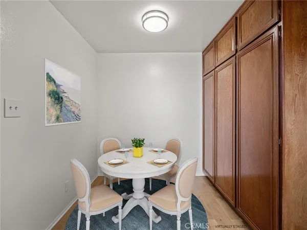 a view of a dining room with furniture and window