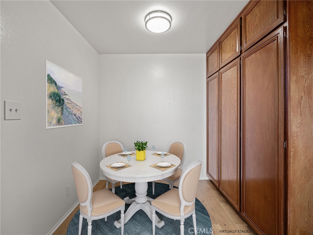 8180 Manitoba Street, Unit 302 Playa del Rey, CA 90293 - Photo 7 of 31 a view of a dining room with furniture and window