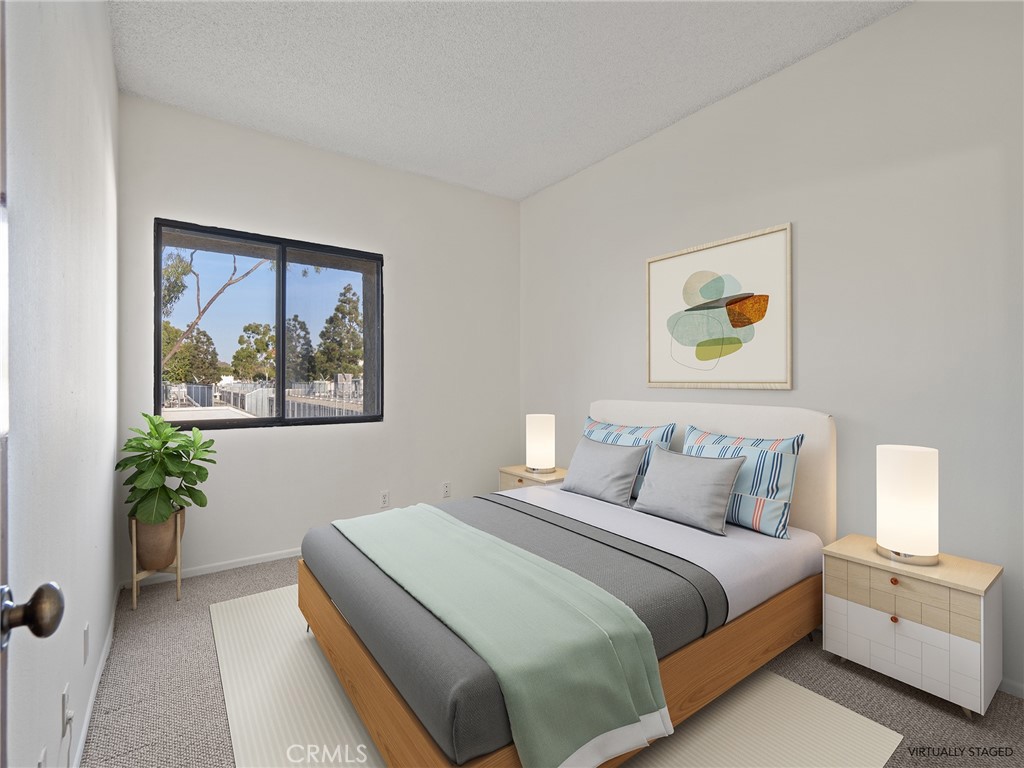 8180 Manitoba Street, Unit 302 Playa del Rey, CA 90293 - Photo 9 of 31 a bedroom with a bed and painting on the wall