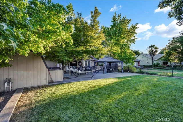 a view of backyard with swimming pool