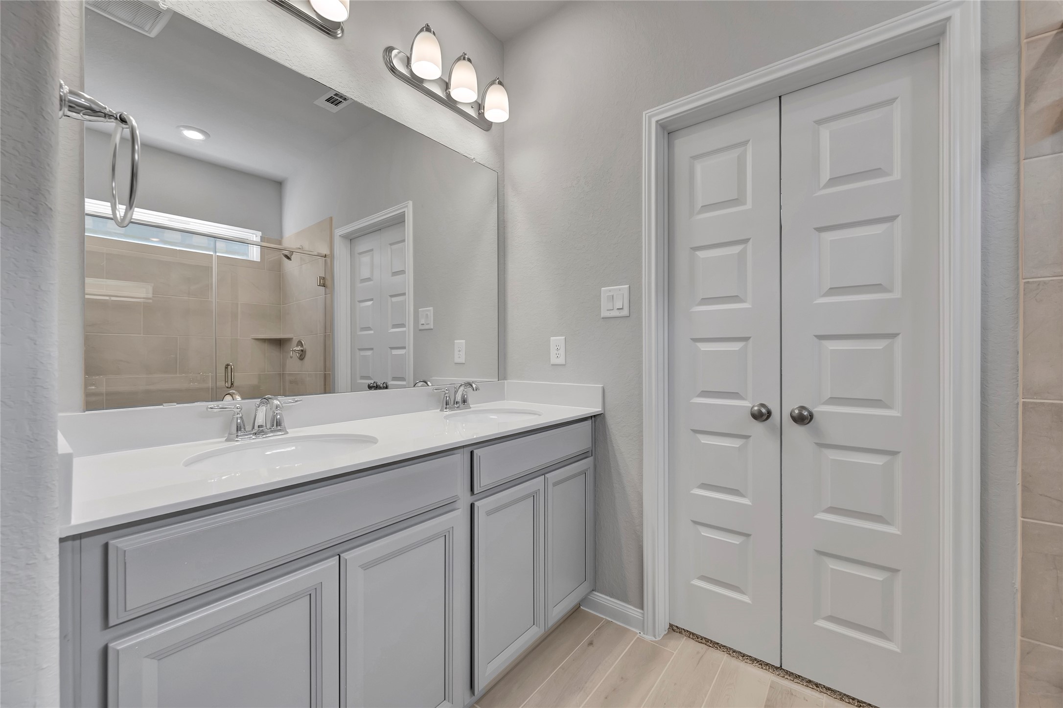 420 Sunrise Ranch Drive Montgomery, TX 77316 - Photo 12 of 26 a bathroom with a double vanity sink and mirror