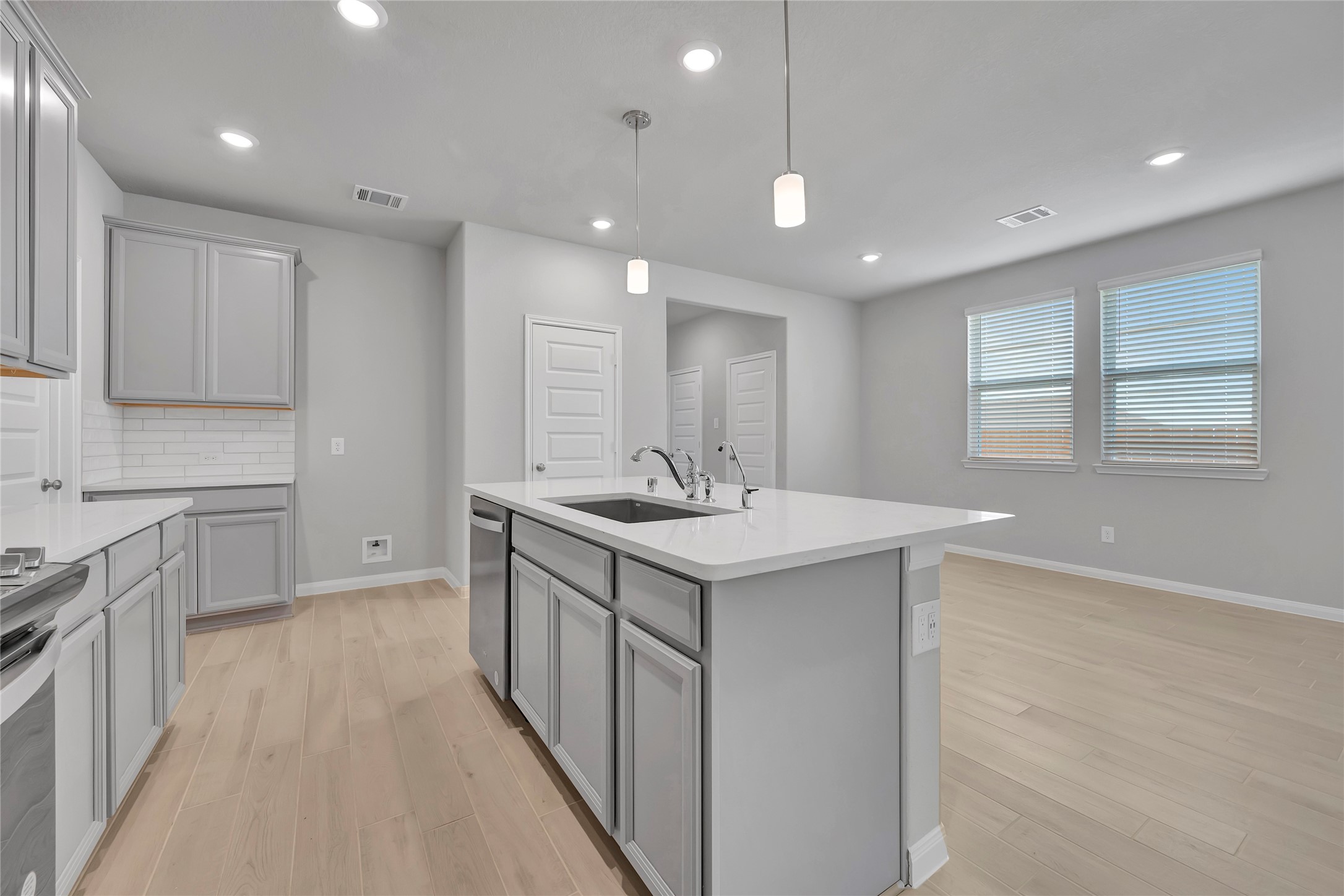 420 Sunrise Ranch Drive Montgomery, TX 77316 - Photo 4 of 26 a kitchen with a sink stove and cabinets