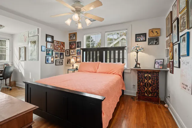 a bed room with a bed and wooden floor