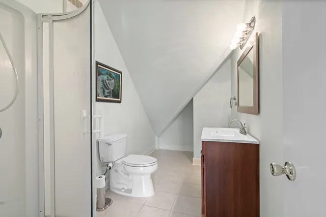 a bathroom with a sink a mirror and a shower