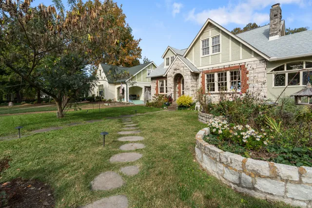 a front view of a house with garden