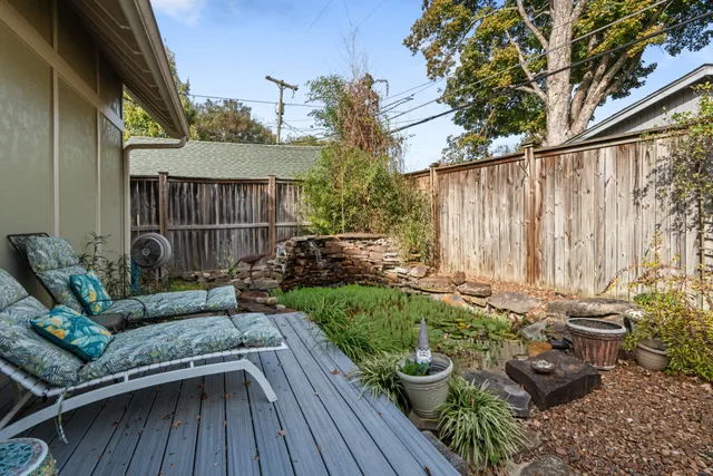 a view of backyard with sitting area