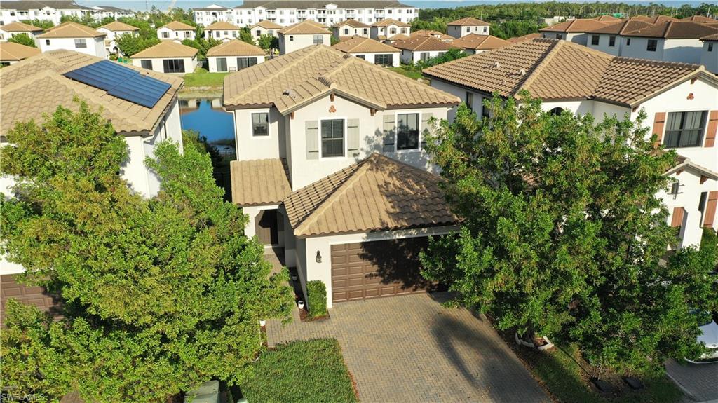 8732 Madrid Circle Naples, FL 34104 - Photo 15 of 15 Birds eye view of property featuring a water view