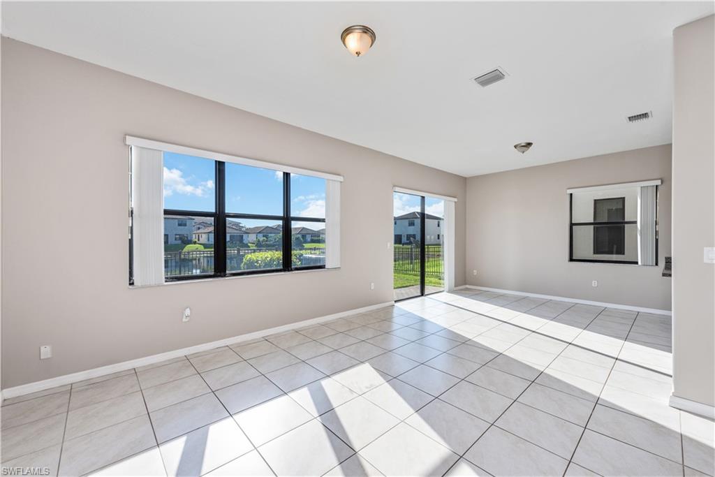 8732 Madrid Circle Naples, FL 34104 - Photo 3 of 15 View of tiled empty room