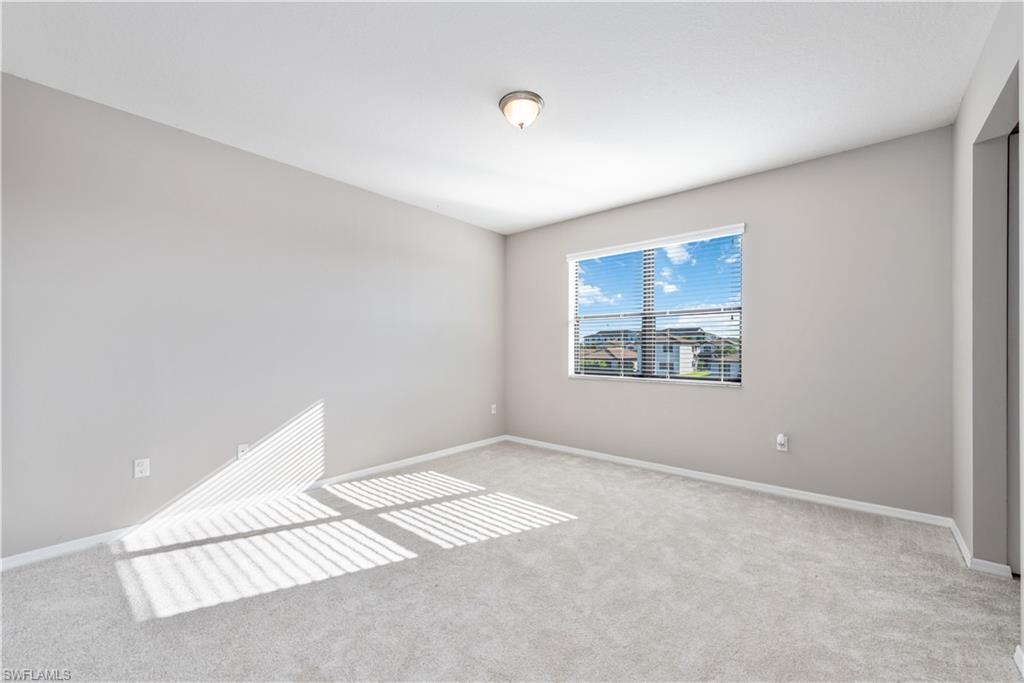 8732 Madrid Circle Naples, FL 34104 - Photo 7 of 15 Master Bedroom