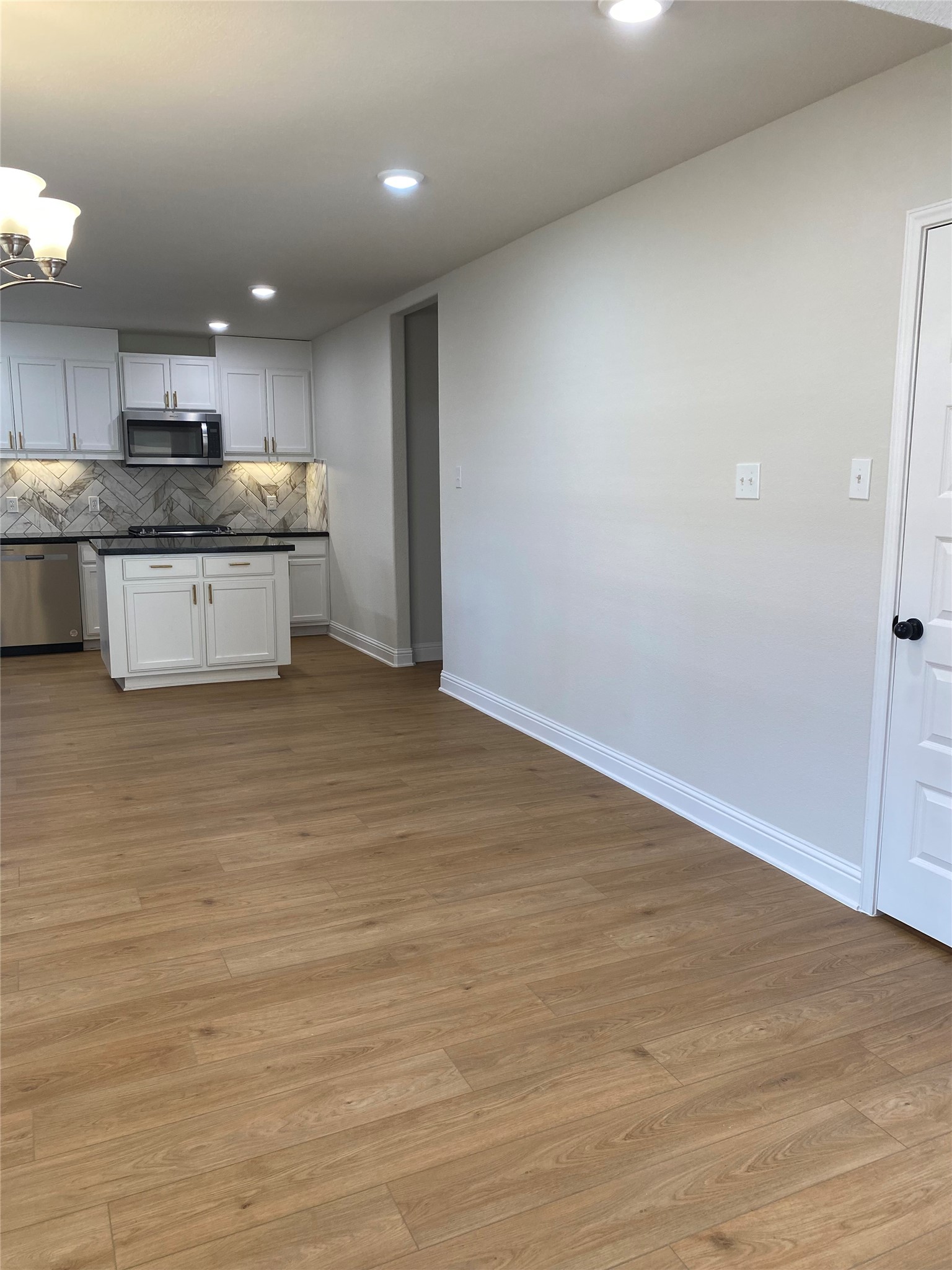 4901 Winnetka Street Houston, TX 77021 - Photo 19 of 45 a large kitchen with stainless steel appliances granite countertop a stove a sink and a refrigerator