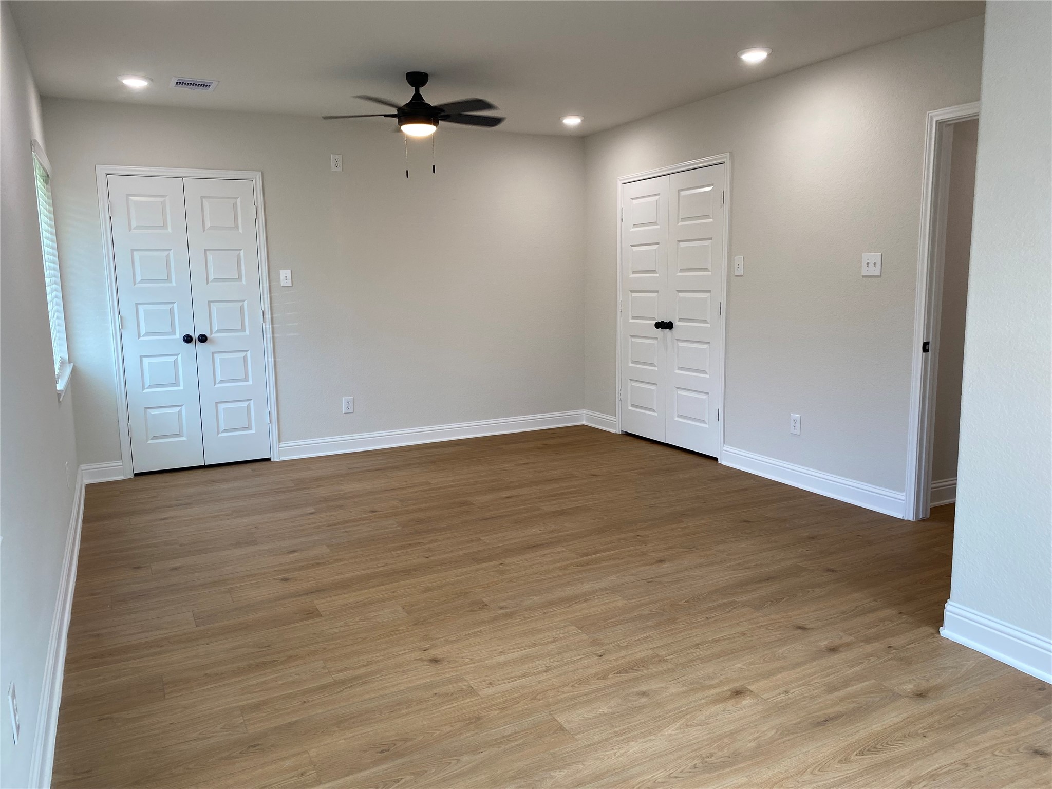 4901 Winnetka Street Houston, TX 77021 - Photo 24 of 45 wooden floor in an empty room with a window