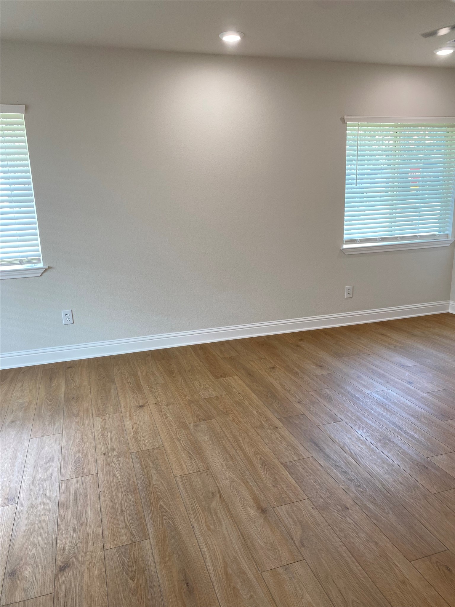 4901 Winnetka Street Houston, TX 77021 - Photo 27 of 45 an empty room with wooden floor and windows