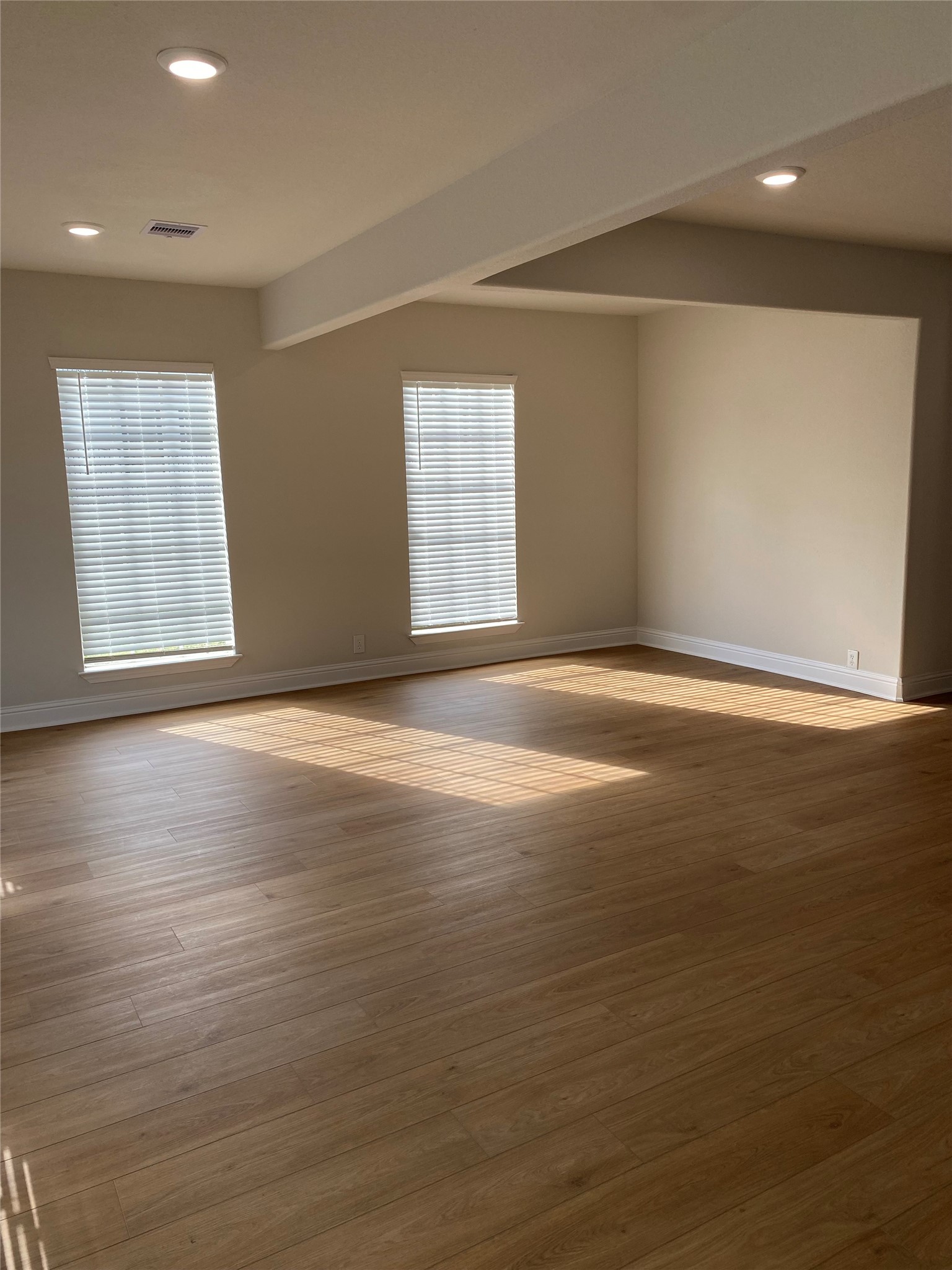 4901 Winnetka Street Houston, TX 77021 - Photo 4 of 45 an empty room with wooden floor and windows