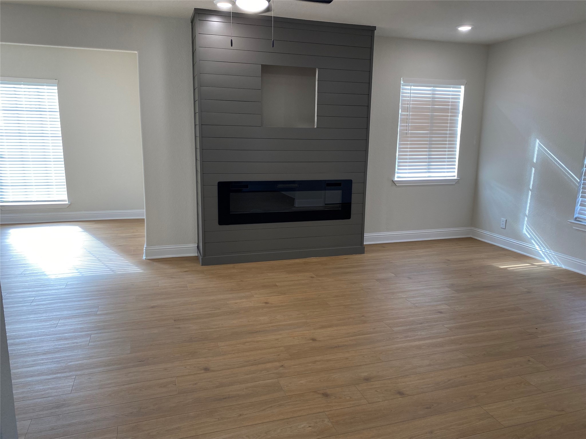 4901 Winnetka Street Houston, TX 77021 - Photo 43 of 45 an empty room with windows and fireplace
