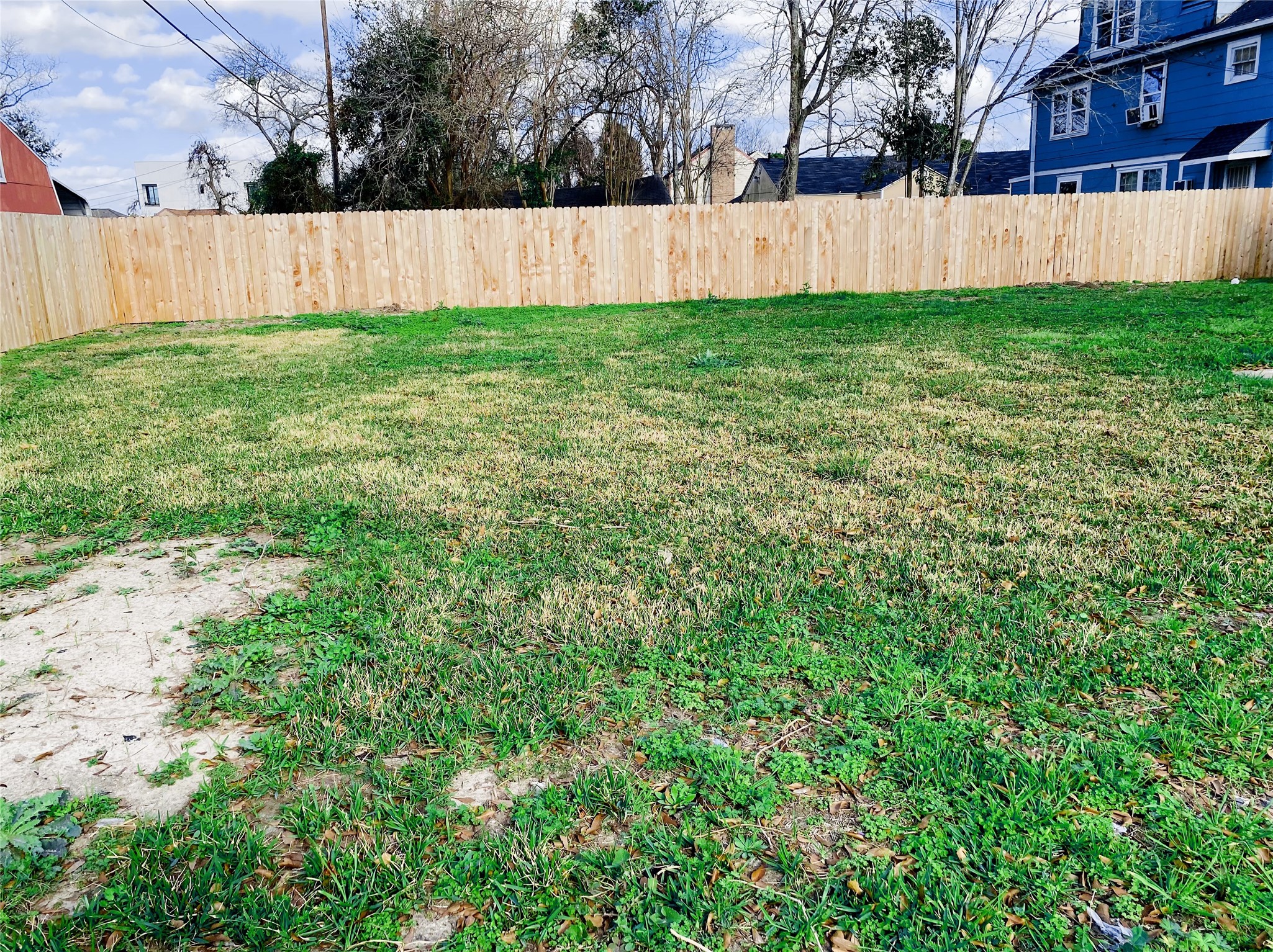 4901 Winnetka Street Houston, TX 77021 - Photo 44 of 45 a view of a backyard with a garden and wooden fence
