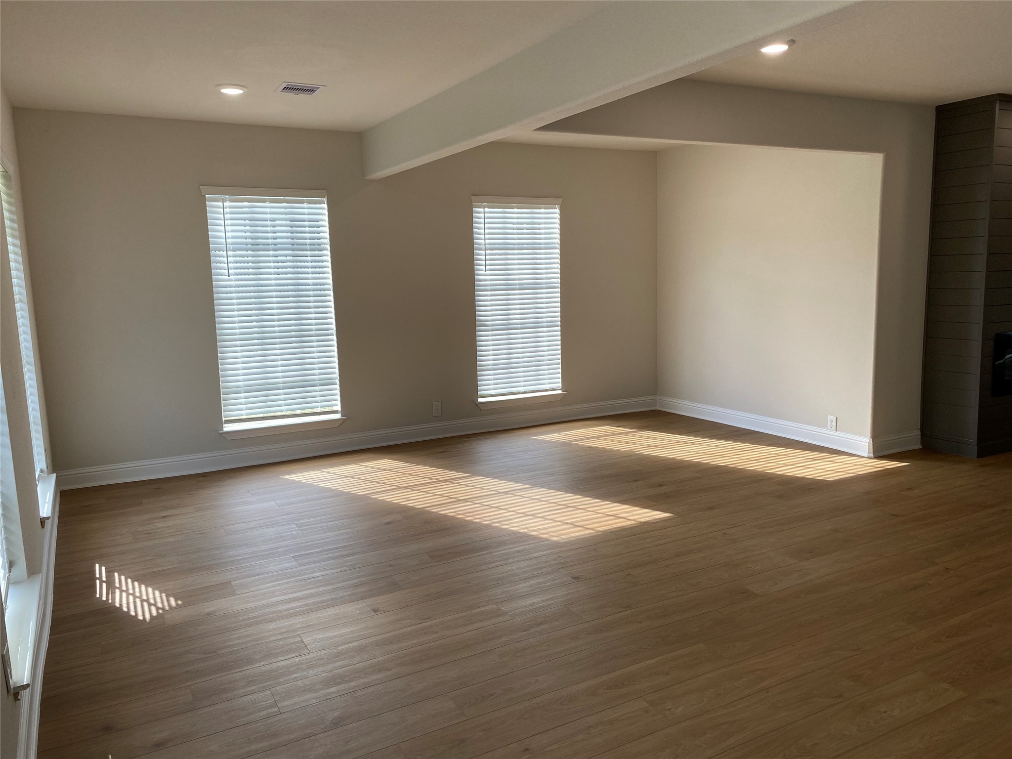 4901 Winnetka Street Houston, TX 77021 - Photo 7 of 45 an empty room with wooden floor and windows