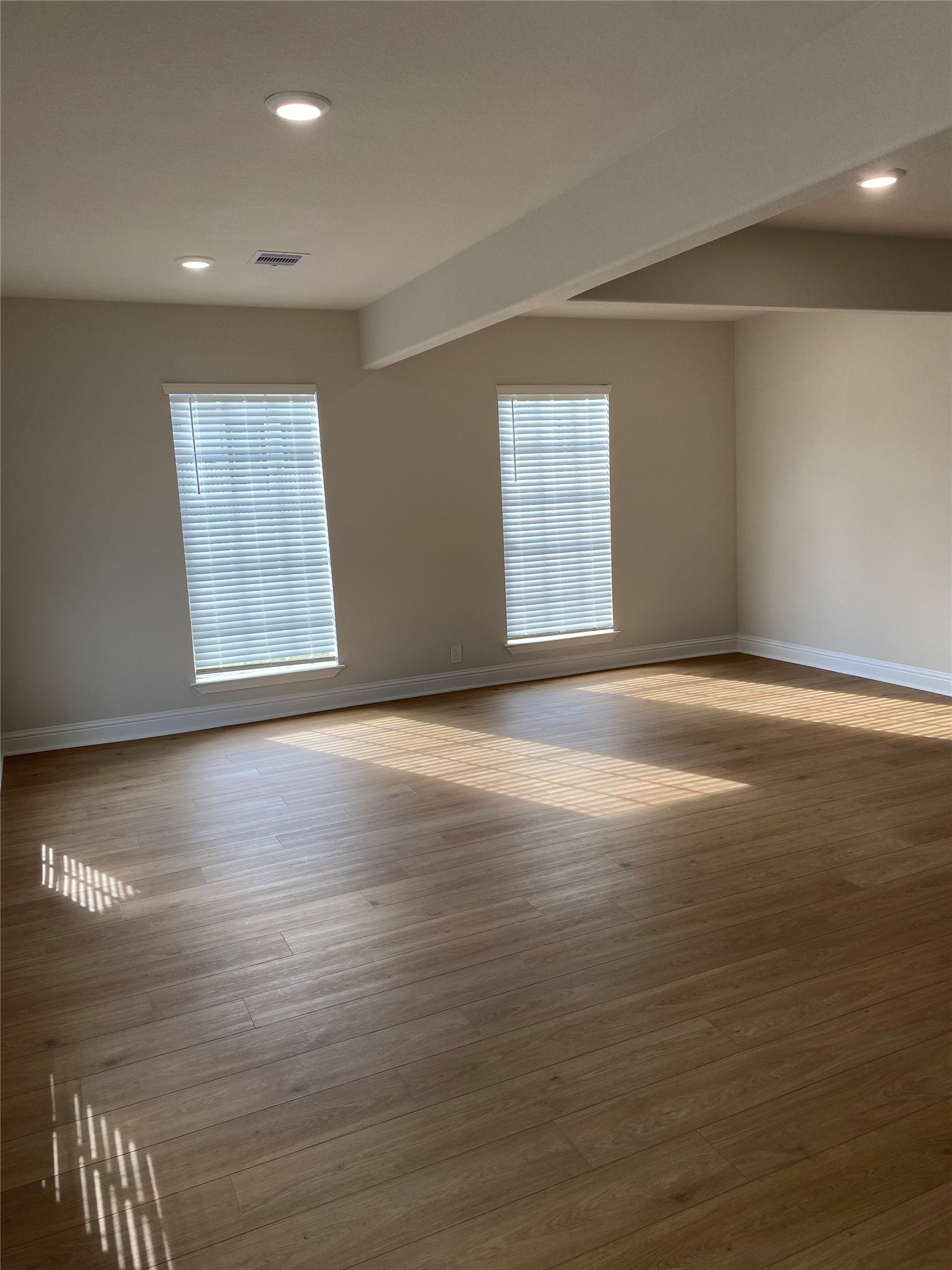 4901 Winnetka Street Houston, TX 77021 - Photo 8 of 45 a view of an empty room with wooden floor and a window
