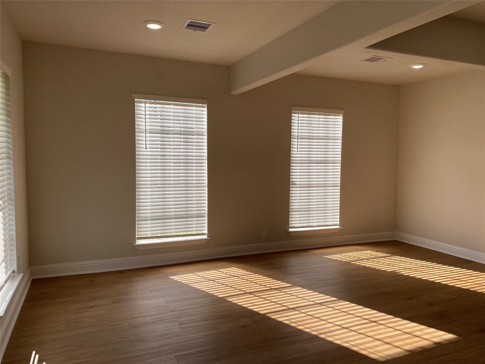 4901 Winnetka Street Houston, TX 77021 - Photo 10 of 45 a view of an empty room with wooden floor and a window
