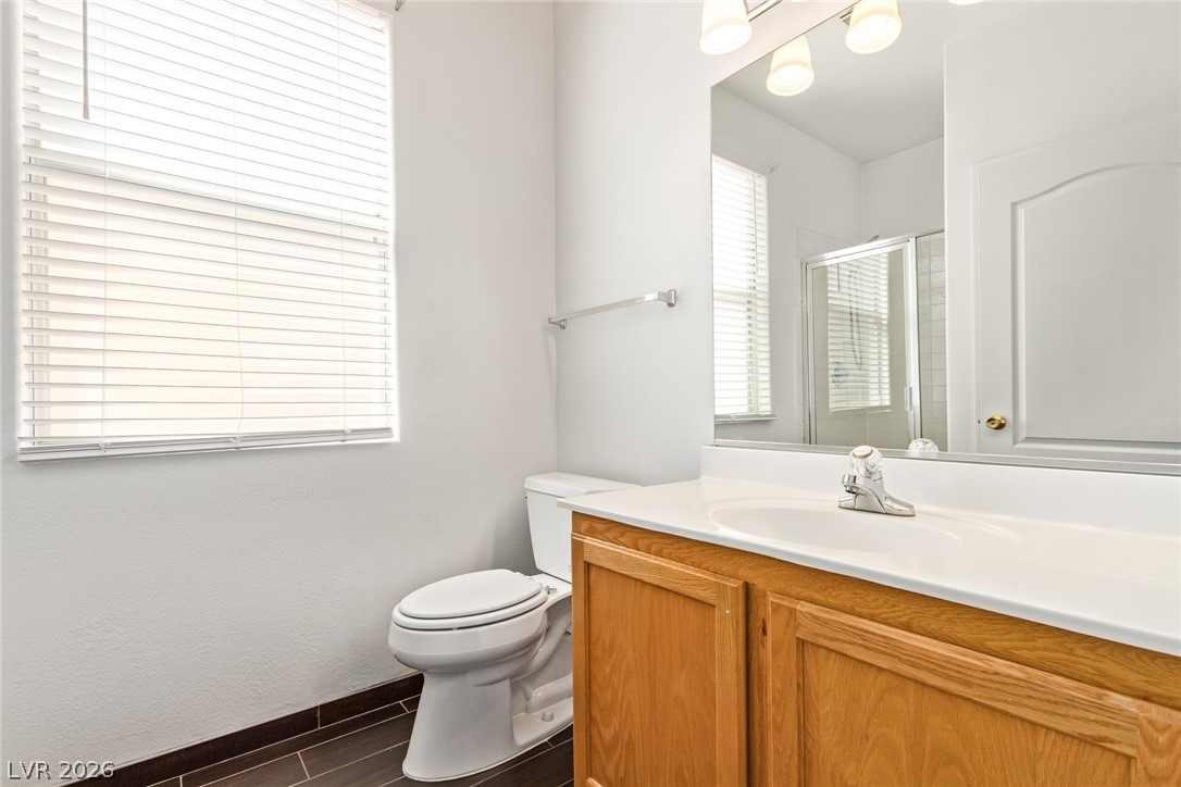 1477 Rancho Ridge Drive Henderson, NV 89012 - Photo 38 of 46 A well-lit bathroom provides ample space and a functional layout.