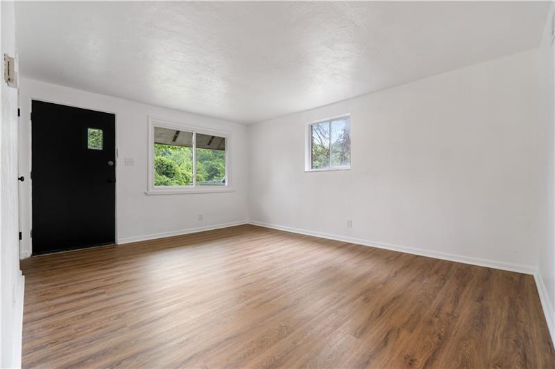 546 Old Frankstown Road Monroeville, PA 15146 - Photo 11 of 47 an empty room with wooden floor and windows