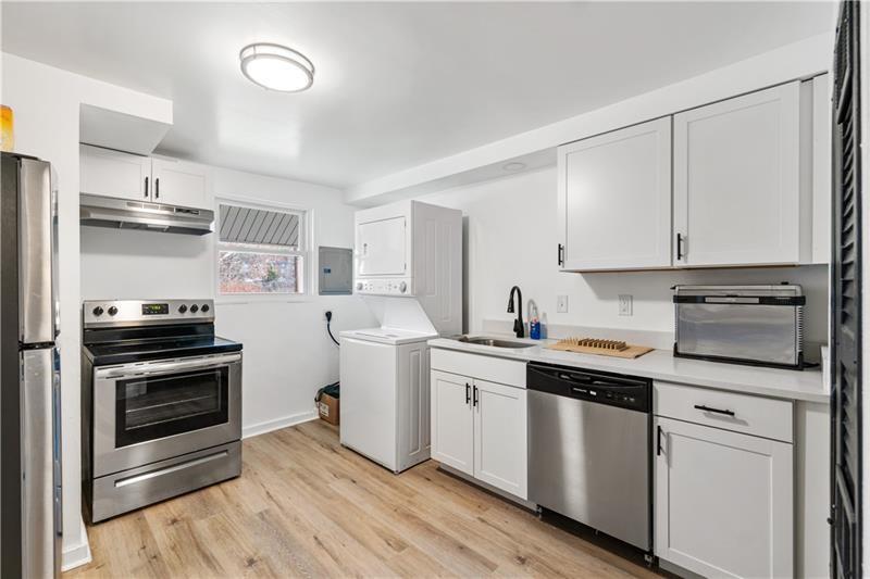 546 Old Frankstown Road Monroeville, PA 15146 - Photo 23 of 47 a kitchen with white cabinets stainless steel appliances and sink