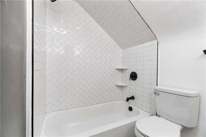 546 Old Frankstown Road Monroeville, PA 15146 - Photo 39 of 47 a bathroom with a toilet and a bathtub