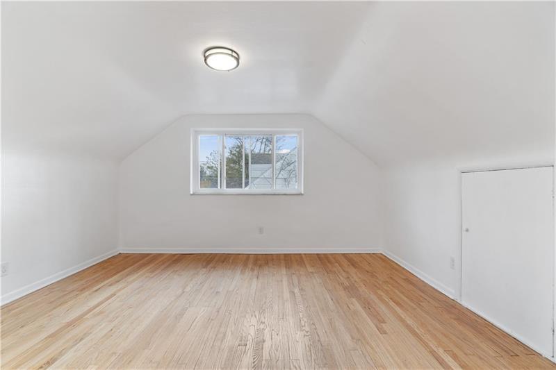 546 Old Frankstown Road Monroeville, PA 15146 - Photo 41 of 47 an empty room with wooden floor and windows