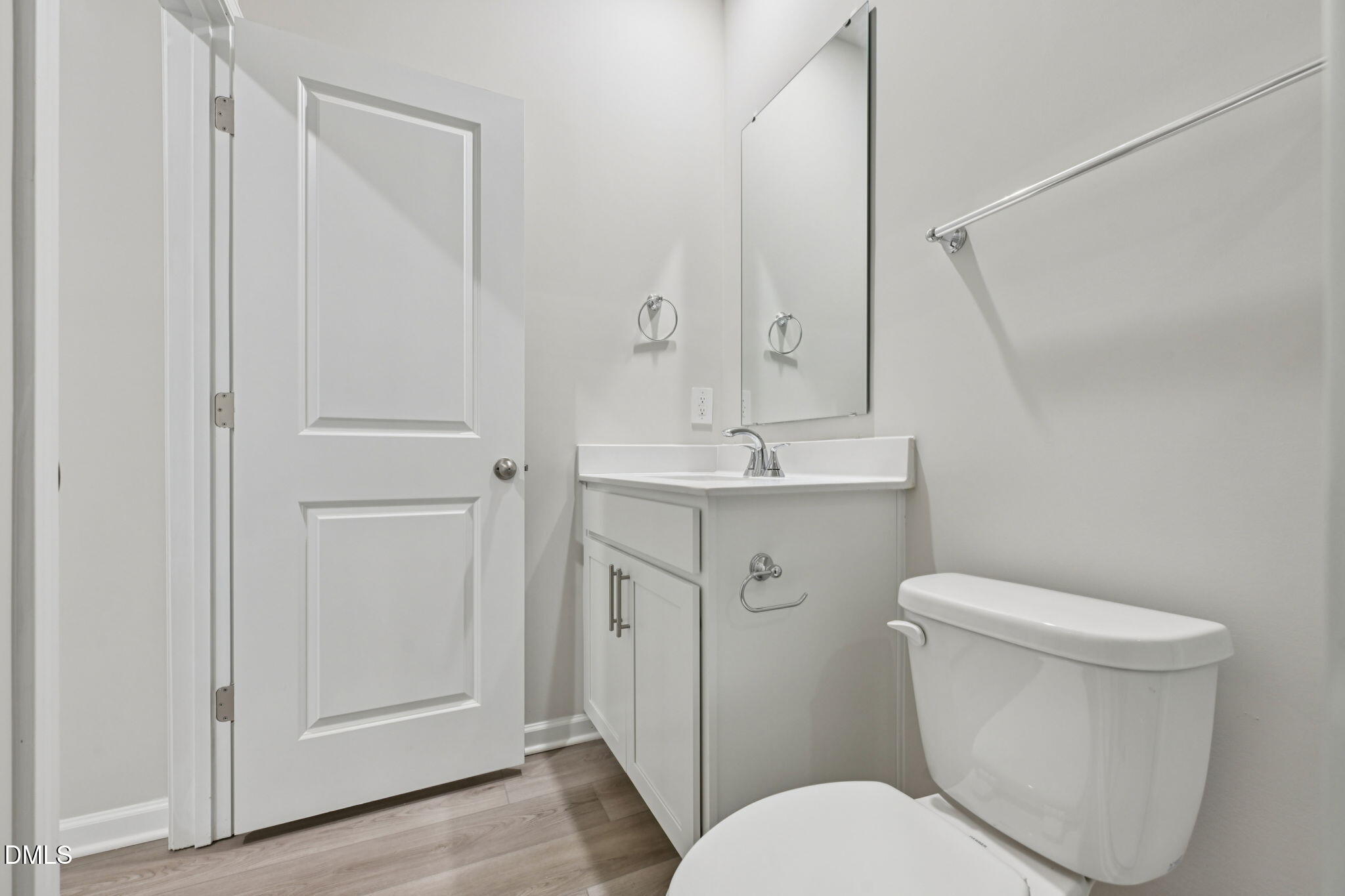 2145 Topsail Road Durham, NC 27703 - Photo 21 of 49 a white toilet sitting next to a bathroom sink