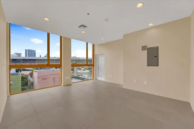 a view of an empty room with a large window