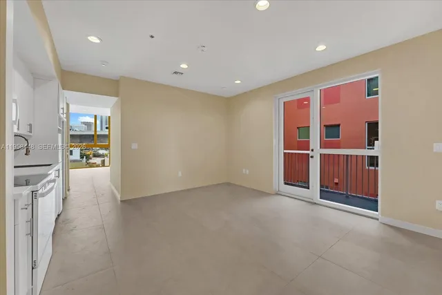 an empty room with wooden floor and closet