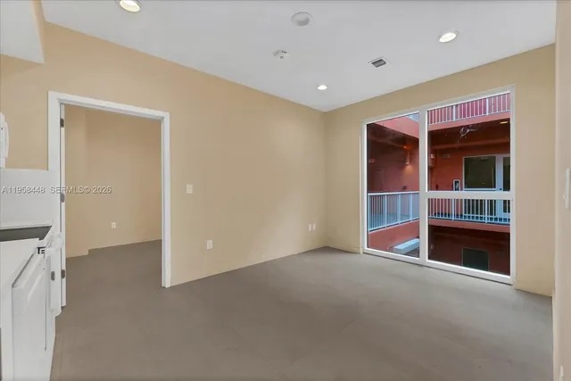 a kitchen with cabinets and white appliances
