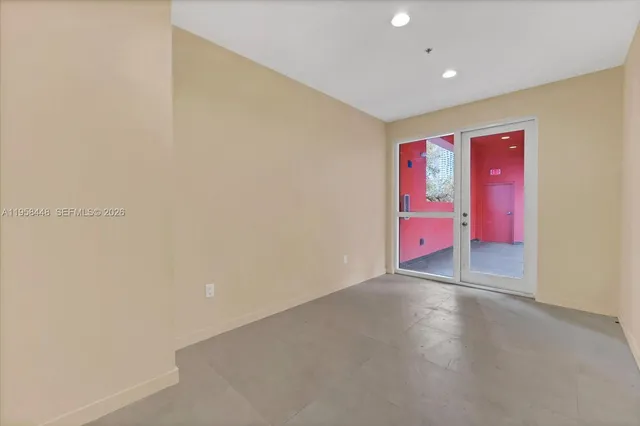 wooden floor in a room with a kitchen