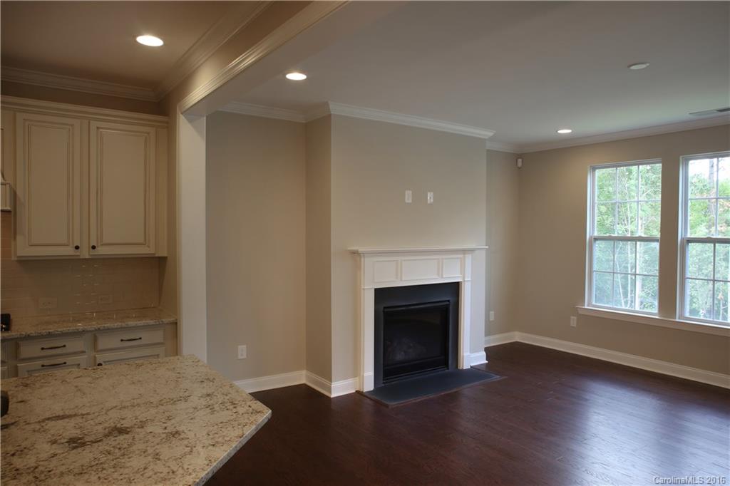 1033 Emory Lane, Unit 70 Fort Mill, SC 29708 - Photo 5 of 21 a view of a livingroom with an empty space and a fireplace