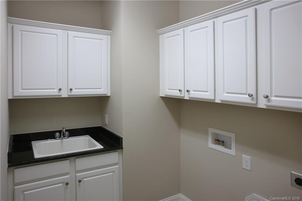 1033 Emory Lane, Unit 70 Fort Mill, SC 29708 - Photo 8 of 21 a view of cabinets and utility room with a sink