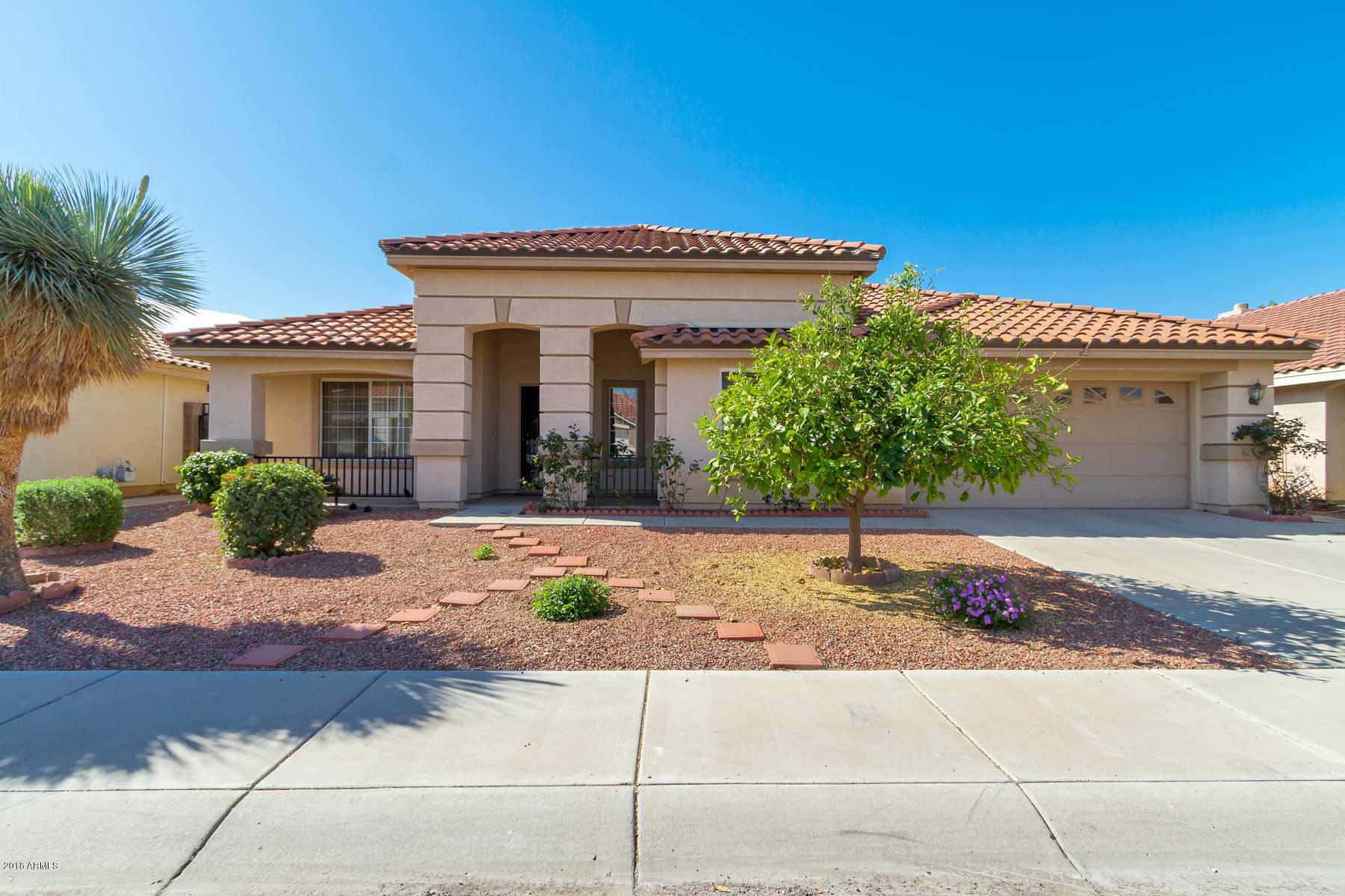 3941 West Charter Oak Road Phoenix, AZ 85029 - Photo 1 of 25 a front view of a house with a garden