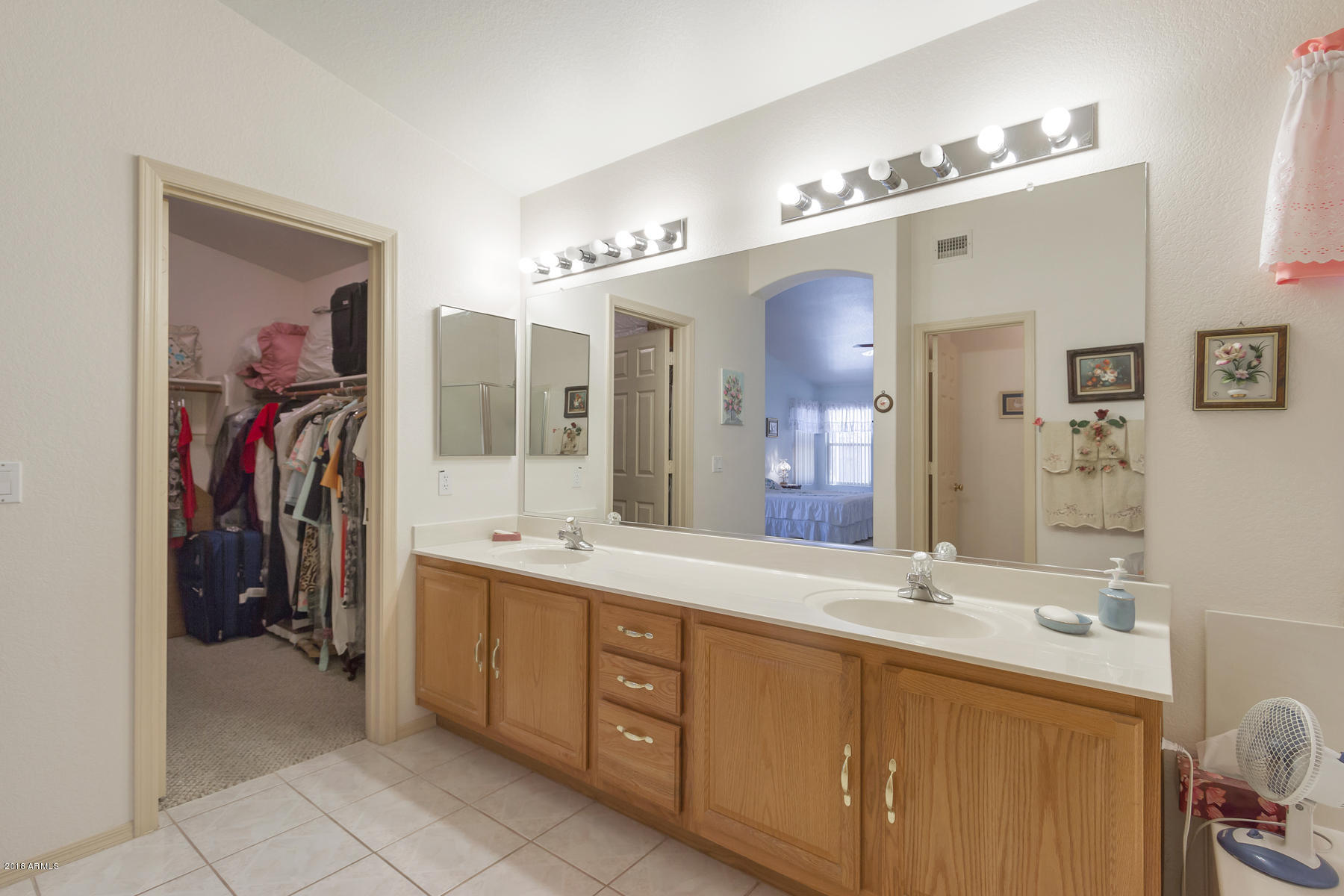 3941 West Charter Oak Road Phoenix, AZ 85029 - Photo 11 of 25 a spacious bathroom with a double vanity sink a mirror a and a shower