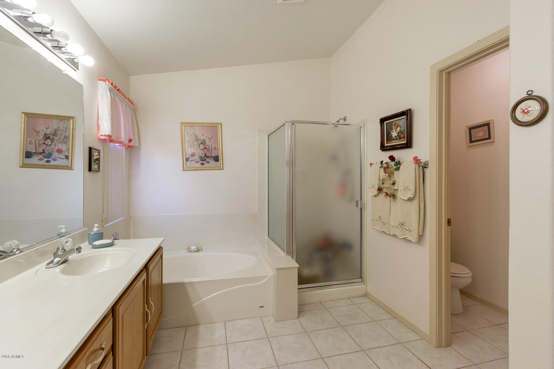 3941 West Charter Oak Road Phoenix, AZ 85029 - Photo 12 of 25 a bathroom with a tub sink and shower
