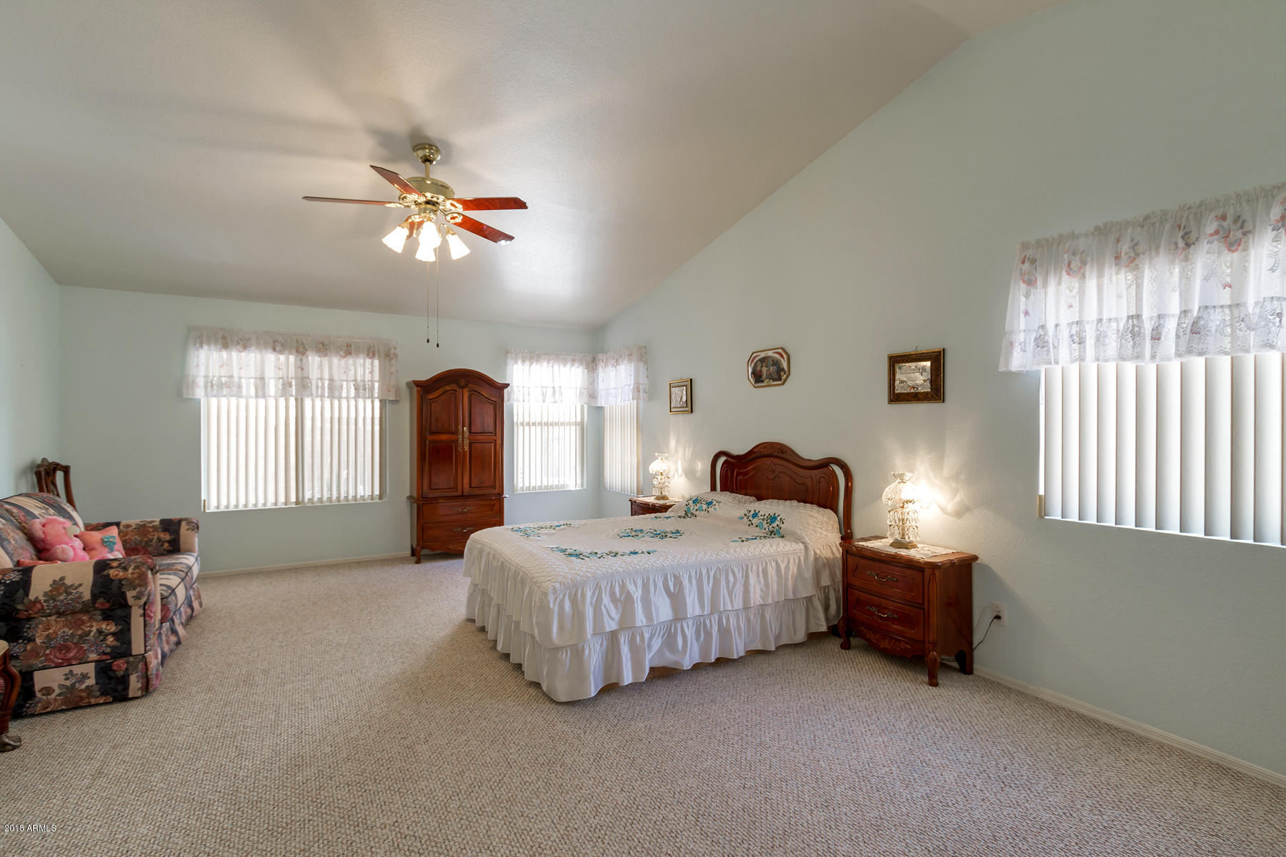 3941 West Charter Oak Road Phoenix, AZ 85029 - Photo 13 of 25 a living room with a bed furniture chandelier and a window