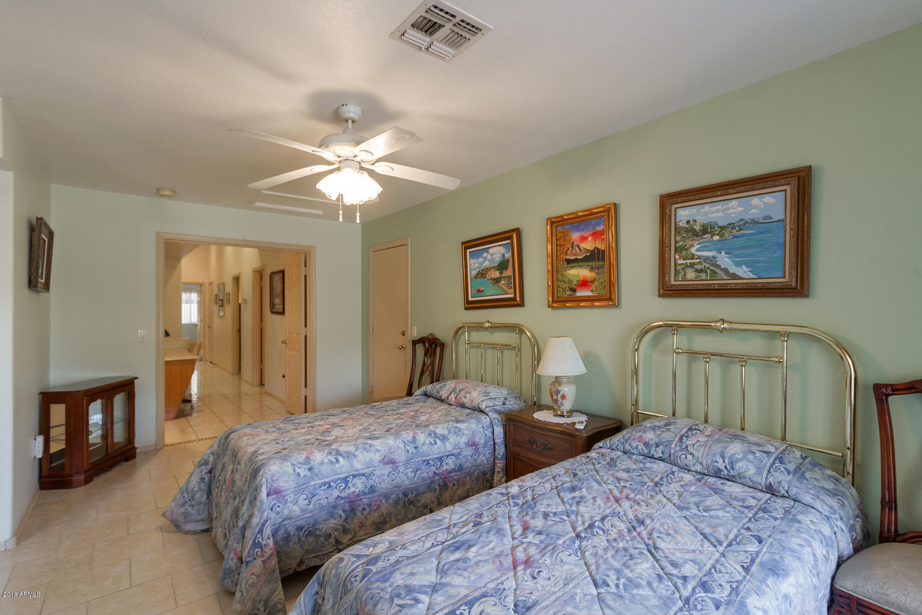 3941 West Charter Oak Road Phoenix, AZ 85029 - Photo 19 of 25 a bedroom with two beds and a chandelier