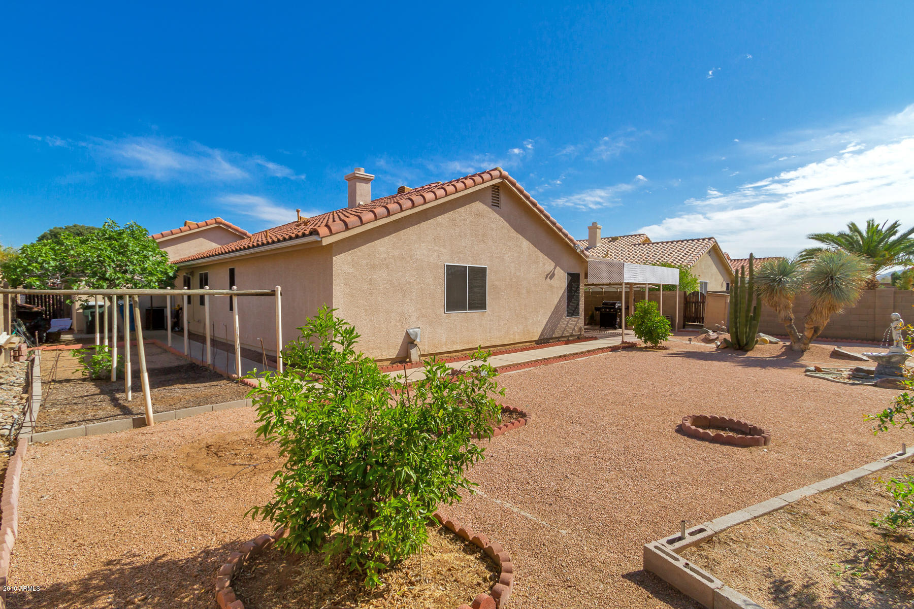 3941 West Charter Oak Road Phoenix, AZ 85029 - Photo 23 of 25 a view of a house with backyard and sitting area
