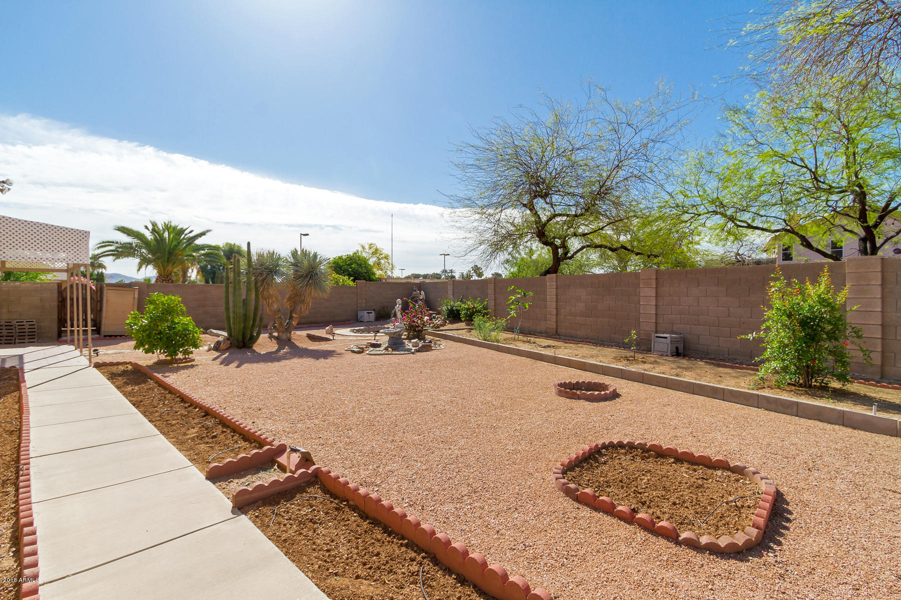 3941 West Charter Oak Road Phoenix, AZ 85029 - Photo 24 of 25 a view of a backyard and a tree