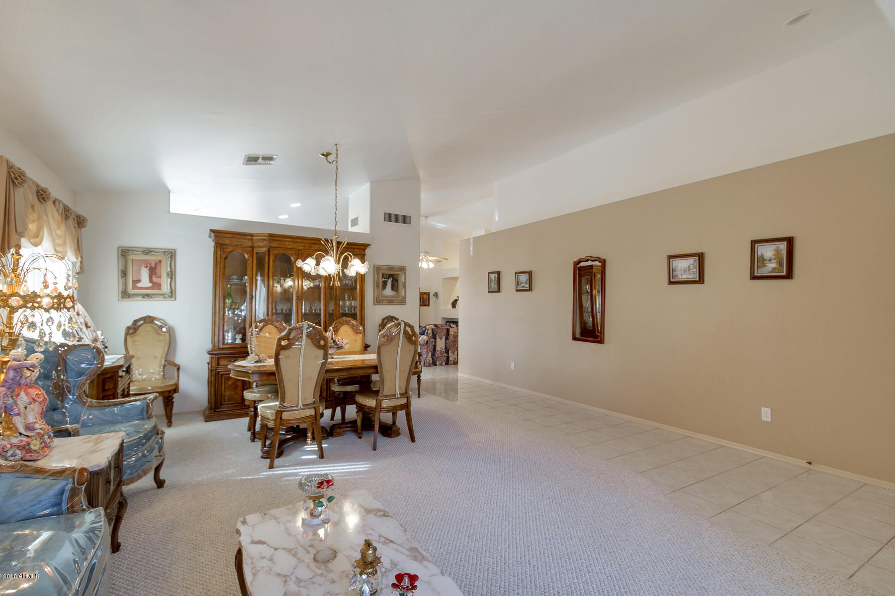 3941 West Charter Oak Road Phoenix, AZ 85029 - Photo 7 of 25 a living room with furniture and a large window